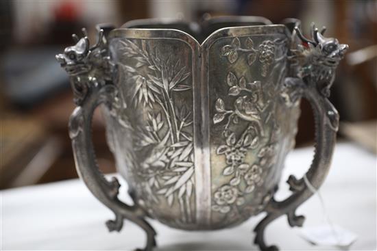 A late 19th/early 20th century Chinese Export silver small jardinere, on three dragon handle supports by Wang Hing, Hong Kong.